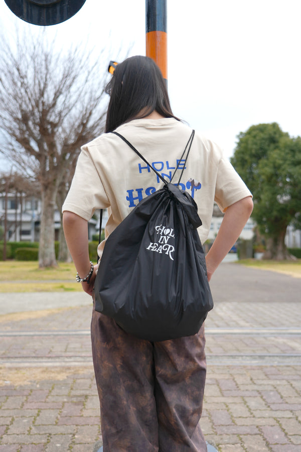 HOLE IN HEART DRAWSTRING BAG