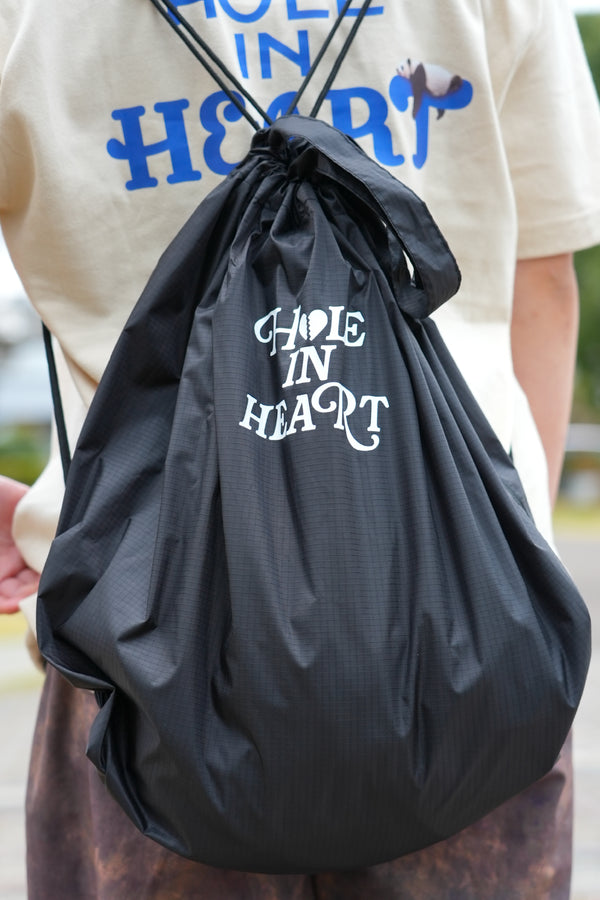 HOLE IN HEART DRAWSTRING BAG